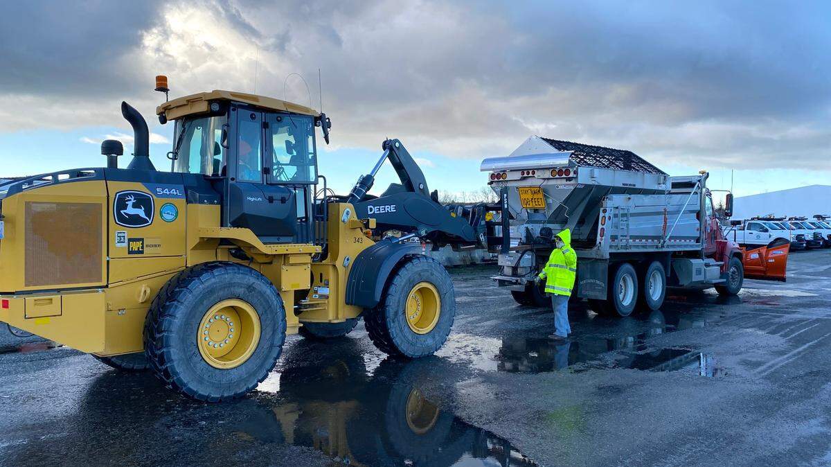 Whatcom County Public Works Department employees get snow-removal and road-treating equipment ready on Jan. 11, 2024, at the Central Shop near Smith and Northwest roads.