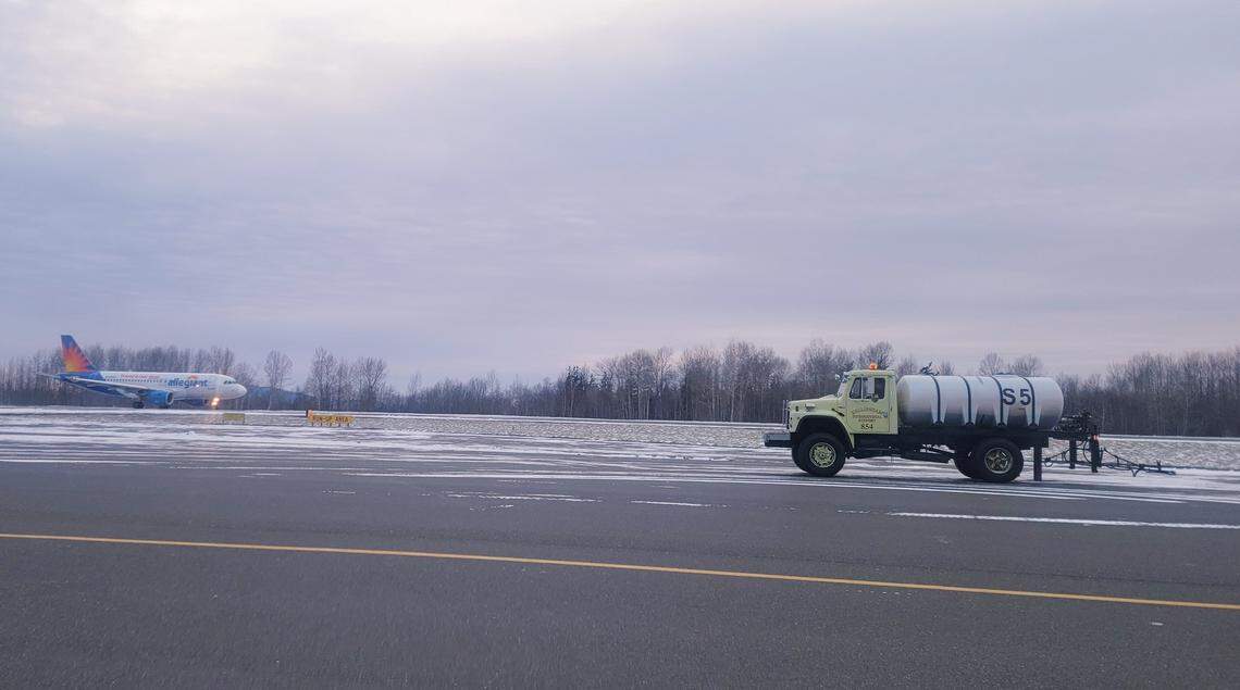 Snow equipment pre-treats the Bellingham International Airport runway in preparation for the additional snowfall forecast for late Wednesday, Dec. 29.