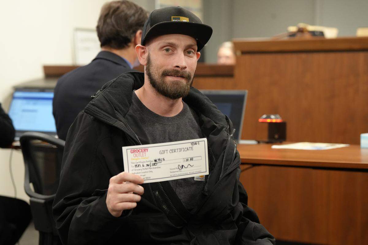 A participant in Whatcom County’s Mental Health Court (MHC), identified as Thomas, was awarded a Grocery Outlet gift certificate for his accomplishments in the program on October 1, 2025, in Bellingham, Wash.