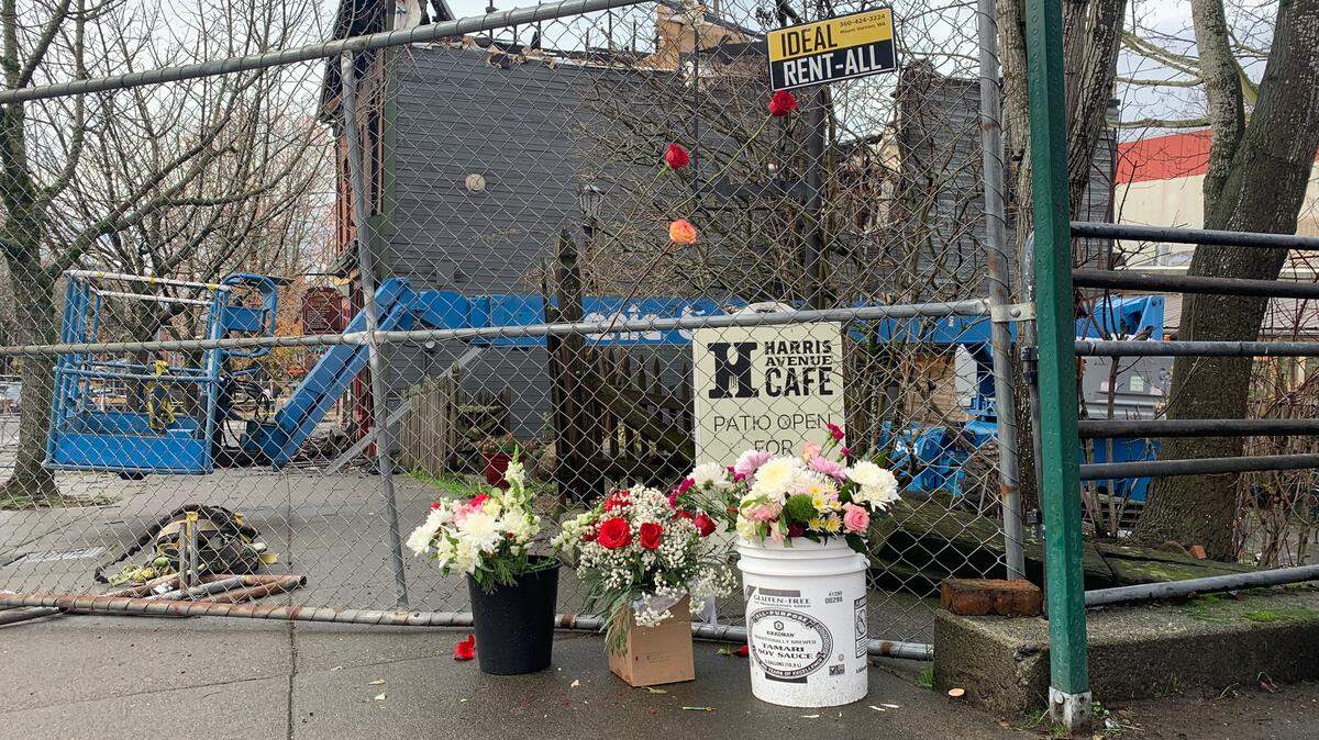 A makeshift memorial began to form on Tuesday, Dec. 19, 2023, outside of the historic Fairhaven Terminal Building that was destroyed by a fire on Sunday, Dec. 17, in Bellingham, Wash.