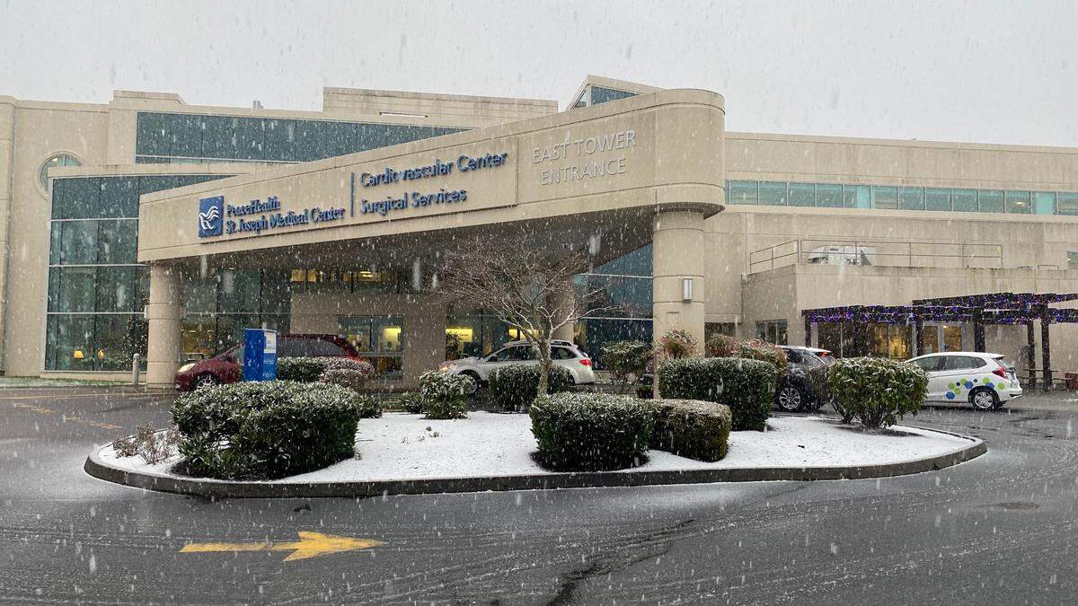 Snow falls at St. Joseph hospital Monday afternoon, Dec. 21, in Bellingham.