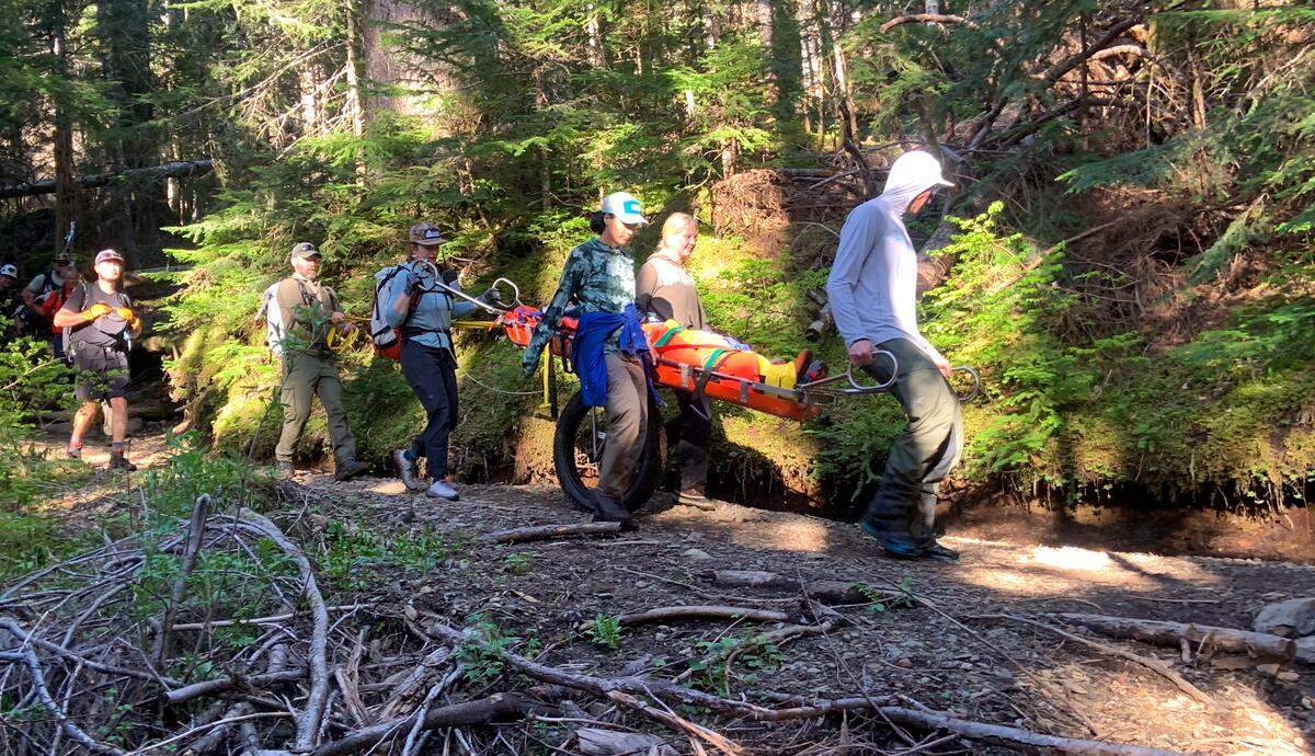Team members from Bellingham Mountain Rescue navigate a wheeled litter down the Heliotrope Ridge trail near Mount Baker in this undated photo.