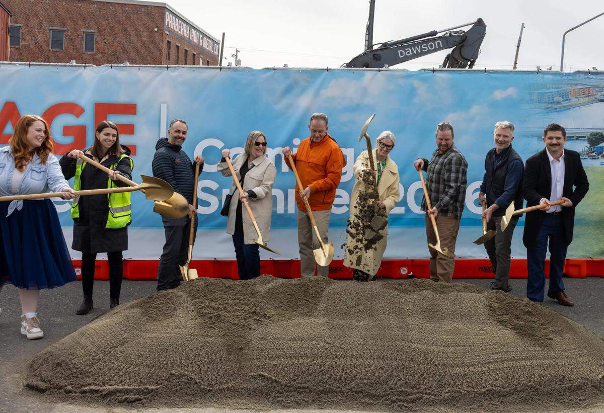Bellingham Mayor Kim Lund and Community and Economic Development Manager Tara Sundin (fourth from left) joined members of the Old Town Village development team on March 14 to celebrate the beginning of the Old Town District development.
