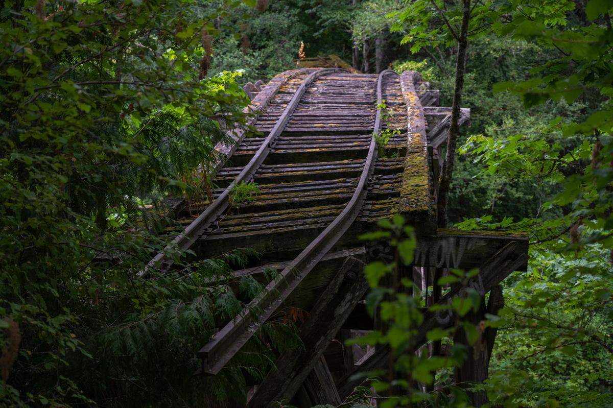 Railroad tracks lead to the trestle that crosses Whatcom Creek on the south end of the Railroad Trail, north of Derby Pond in August 2021.