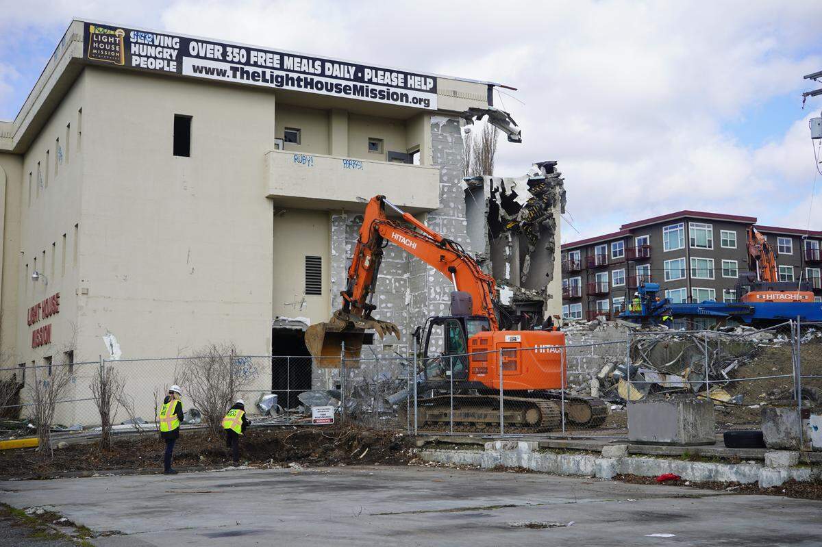 Demolition beings Tuesday, March 14, 2023, at the Lighthouse Mission Ministries building at 910 Holly St. in Bellingham, Wash. A new homeless services facility will be built on the same lot by 2024.                                