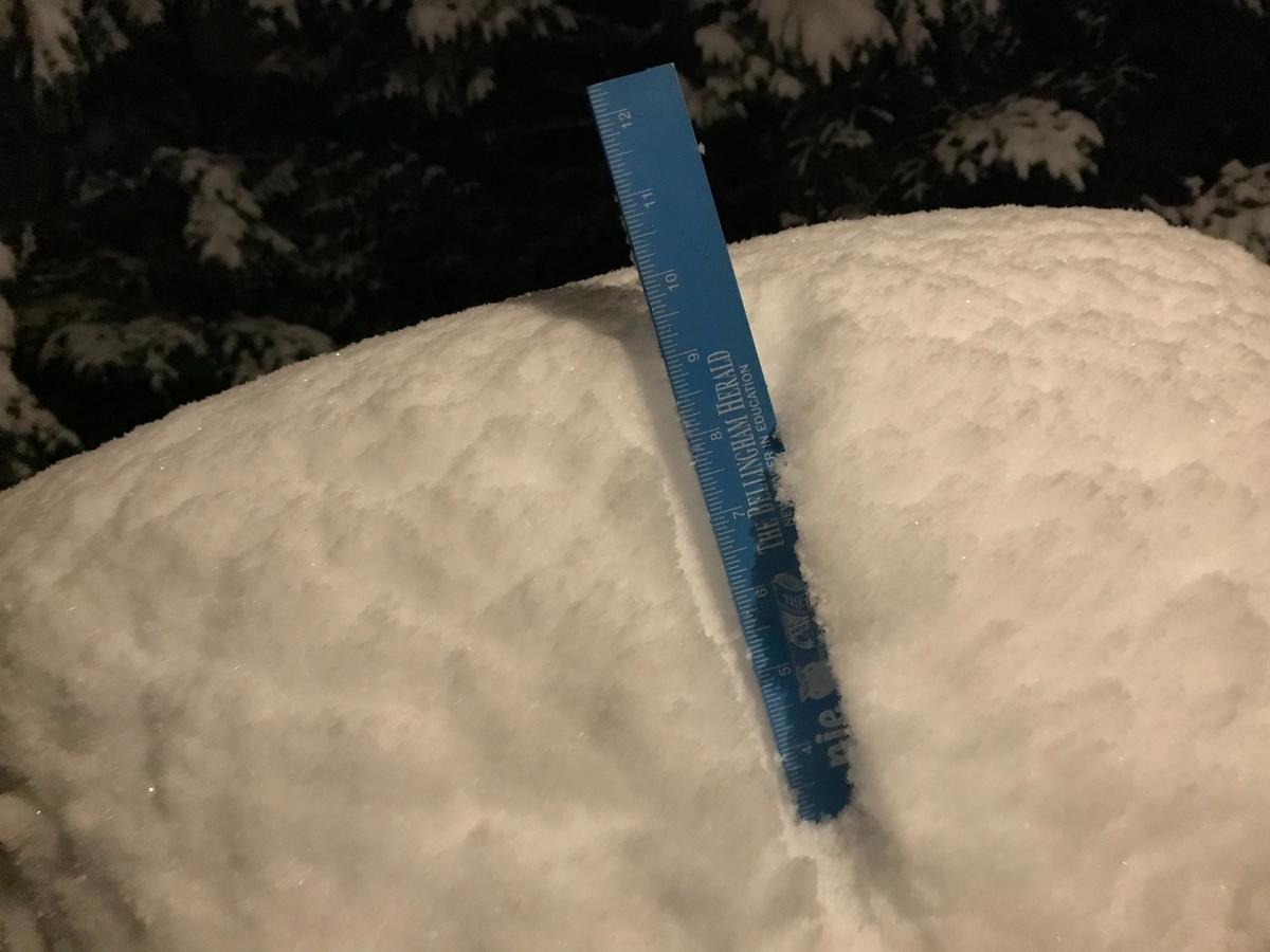 More than 10 inches of snow fell in parts of lowland Whatcom County on the day after Christmas in 2021, as measured by a ruler on a patio table in Sudden Valley.