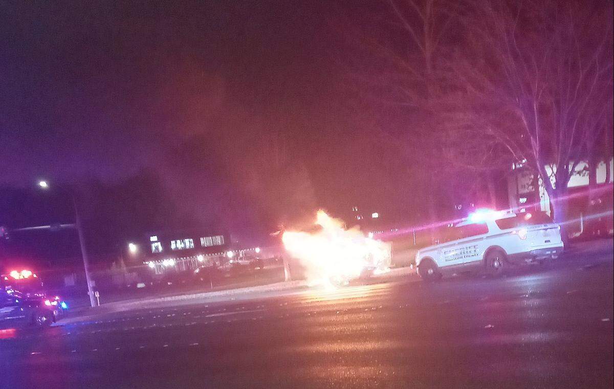 A car burns after a fatal collision at 9:44 p.m. Friday, Jan. 6, 2023, in the 4200 block of Meridian Street in Bellingham, Wash.