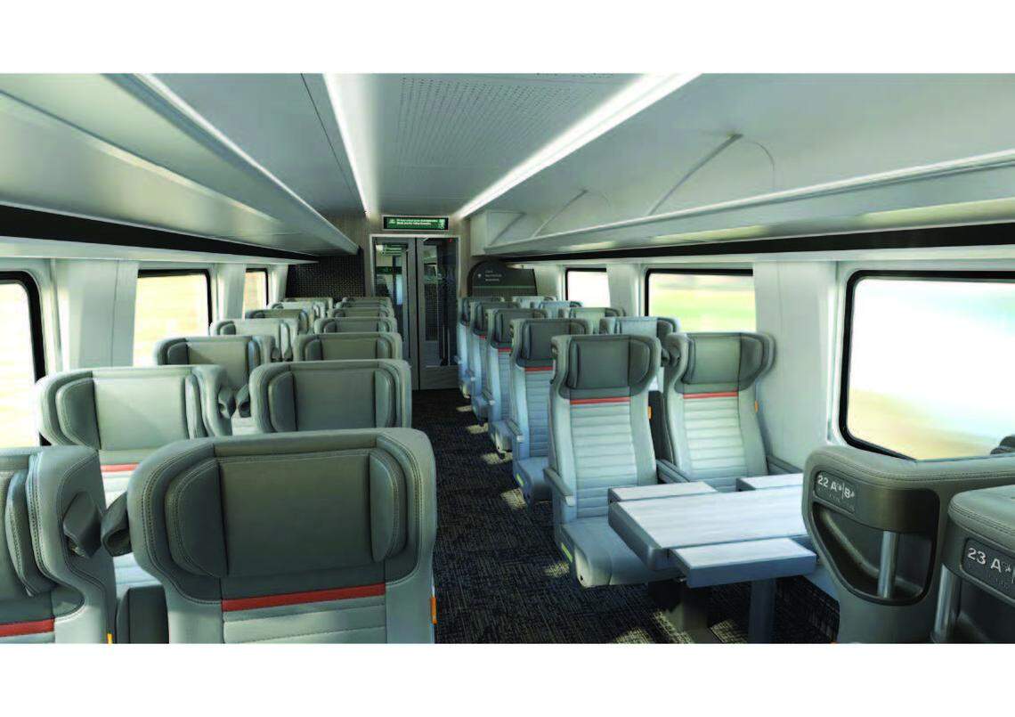 New Northwest-themed Amtrak Cascades trains arriving in 2026 include a business class car with comfortable seating, extra legroom, wood-grain tables and wall decor, and a choice of single or double seating options.