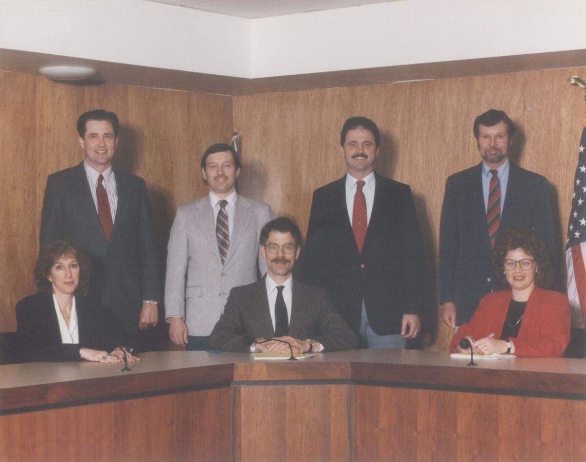 Former Whatcom County Council member Barbara Brenner, front left, is shown with her colleagues during her first term on the council in 1992. Other council members are: front row center Daniel Warner, and front row right Margaret A. Laidlaw. In the back row from left are Dennis J. Vander Yacht, Ken Henderson, Robert A. Imhof and Larry Harris.