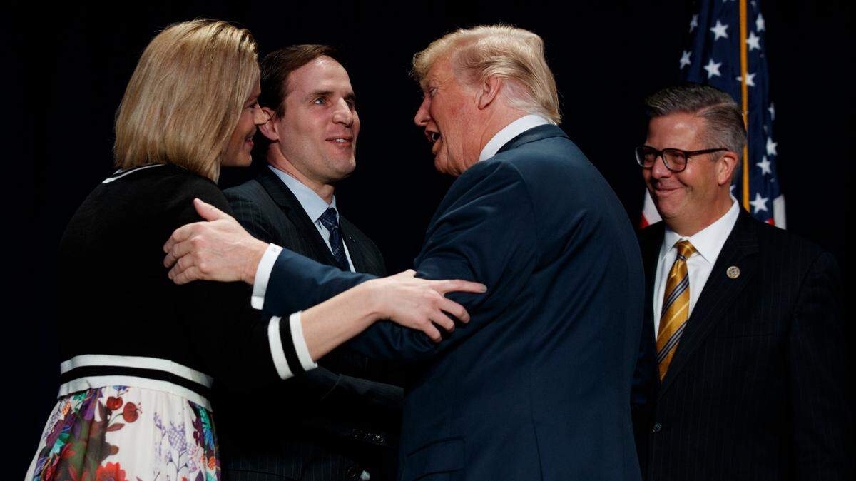 Tiffany Smiley, the likely Republican challenger to U.S. Sen. Patty Murray this fall, is greeted by President Donald Trump during the National Prayer Breakfast in 2018, in Washington, D.C. She attended the event with her husband, Ret. Army Major Scott Smiley. Rep. Randy Hultgren, R-Ill., right, also attended.
