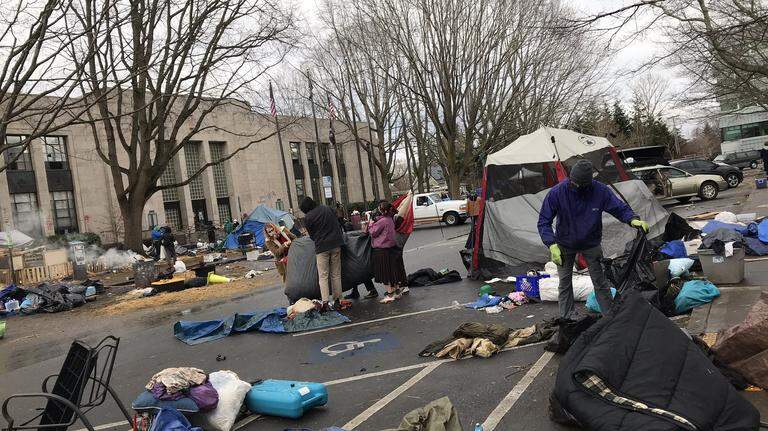 Homeless campers retrieve materials