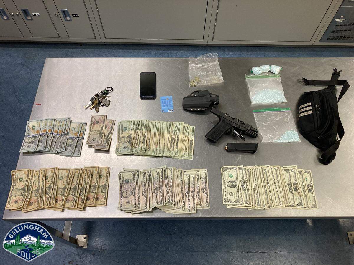 A Bellingham man suspected in an assault outside the 22 North apartment building was reportedly found with a loaded handgun, more than 1,000 fentanyl pills, fentanyl transdermal patches and $2,912 in cash when he was arrested Sunday, July 17.