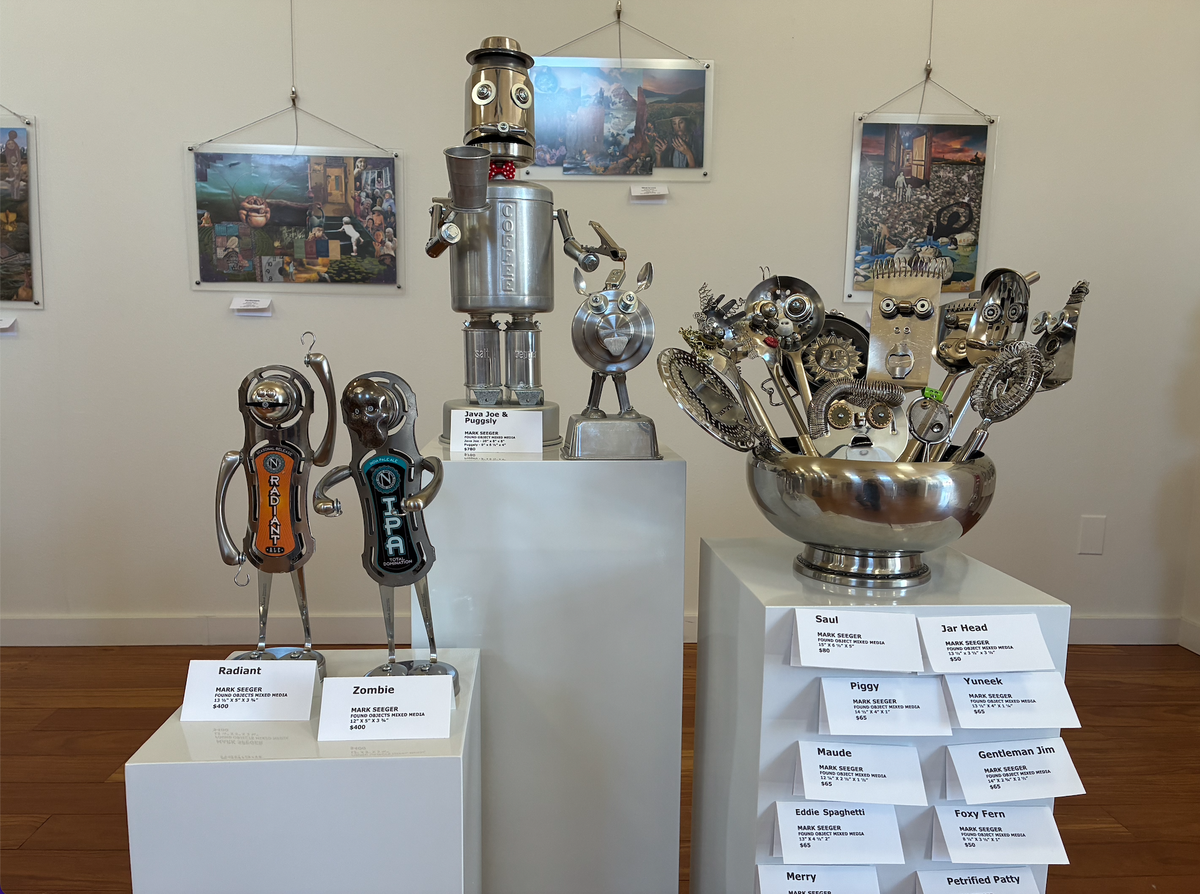 Mark Seeger’s robot figurines, made from repurposed household objects, are on display at Ferndale’s It’s About Time art gallery.