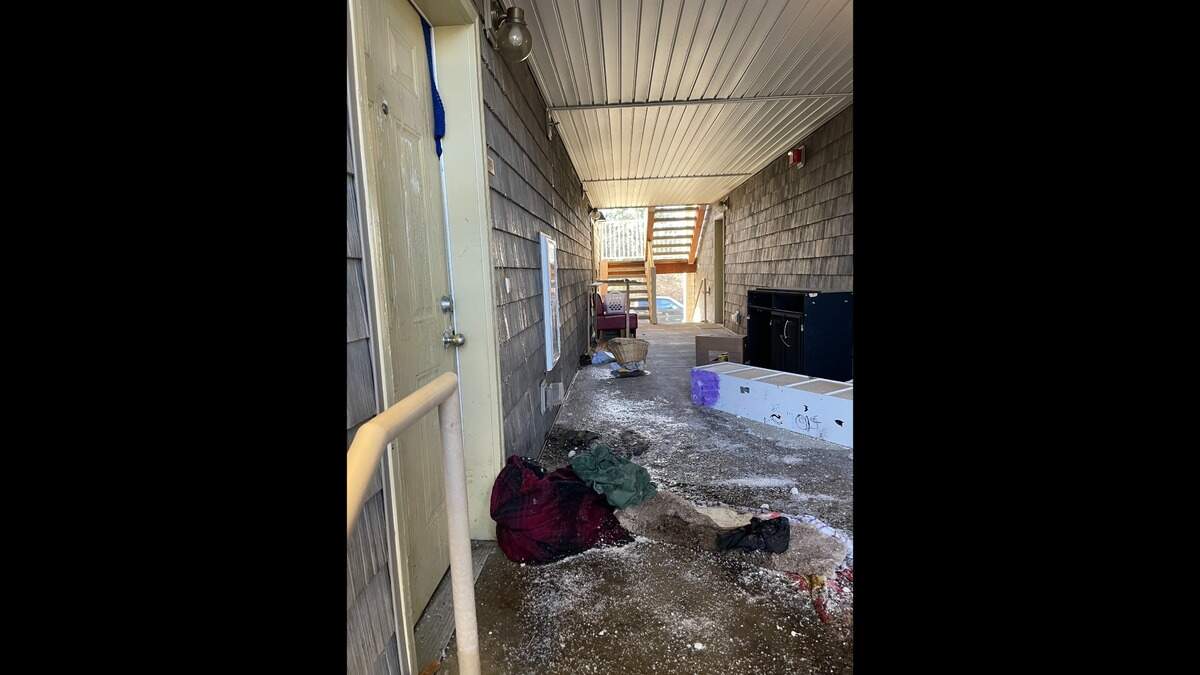 Meadow Wood townhomes residents moved their belongings into the breezeway outside of their unit after fire sprinklers burst and flooded units during January’s record freeze event in Bellingham, Wash. Residents spread salt to prevent ice from forming in the breezeway.