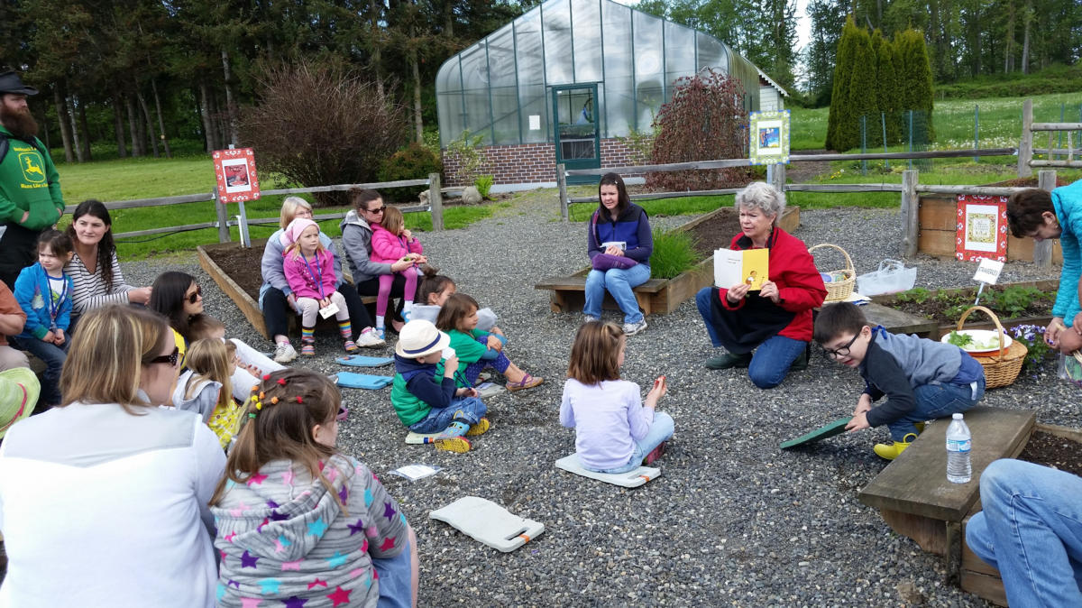 Harriet Arkley talks to kids about gardening at Hovander Homestead Park in Ferndale in the summer of 2017.