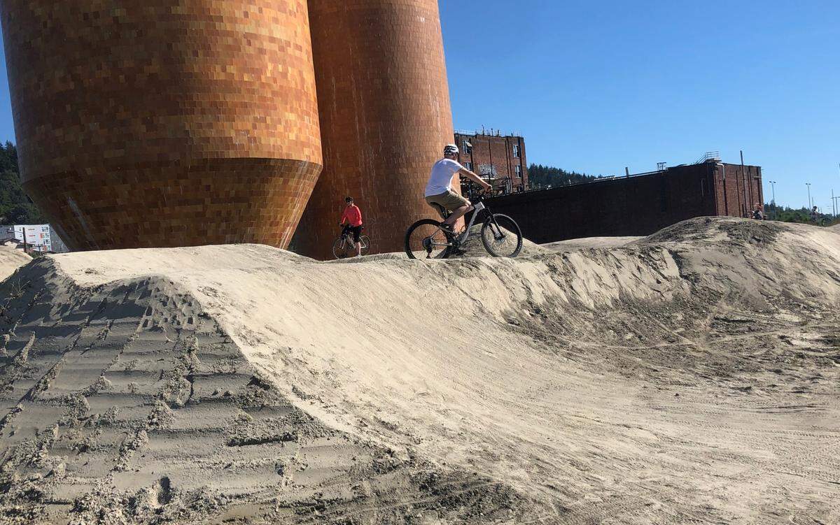 Riders on the Port of Bellingham’s pump track Sunday, June 26, on the waterfront near downtown Bellingham. A “drag race area” was recently added, allowing the participants to race each other.