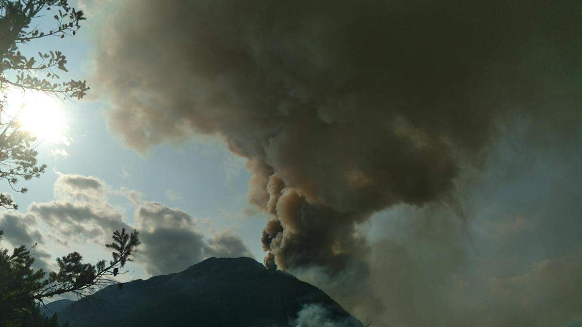 Smoke from the Sourdough Fire rises above the Whatcom County town of Diablo on Aug. 12.