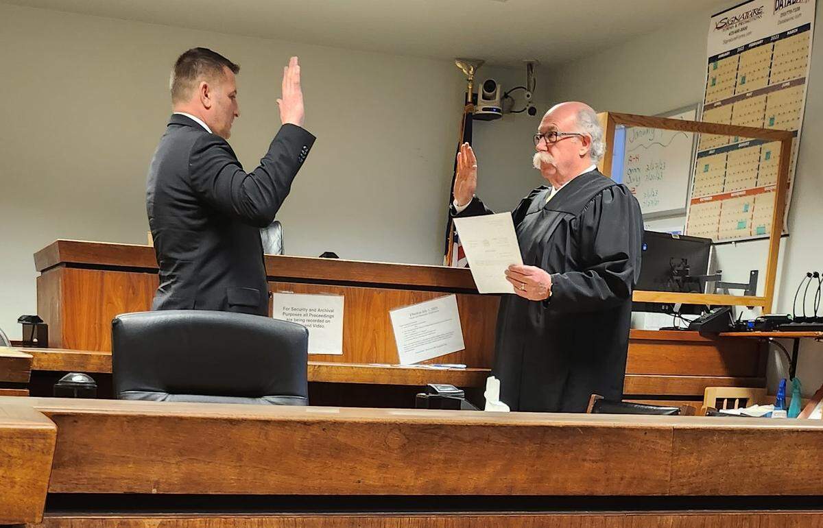 Whatcom County District Court Judge Jonathan Rands, left, is sworn into office Monday, Jan. 9, in Bellingham by Skagit County Superior Court Judge Thomas Verge.