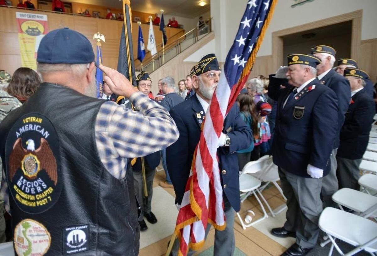 Veterans salute the flag at the 2016 Veterans Day event put on by the Albert J. Hamilton American Legion Post 7 at Bellingham City Hall.