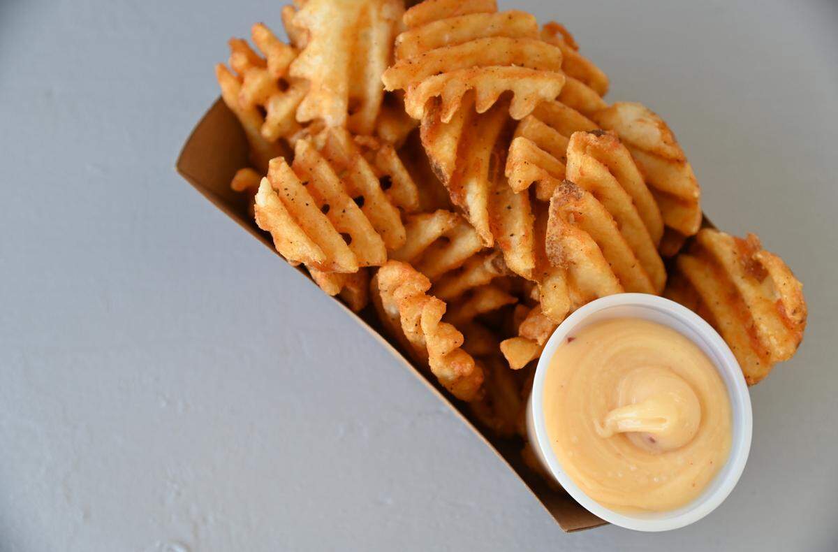 Waffle fries with aioli from the Feast food truck Thursday, Aug. 11, 2022, at the Northwest Washington Fair in Lynden, Wash.