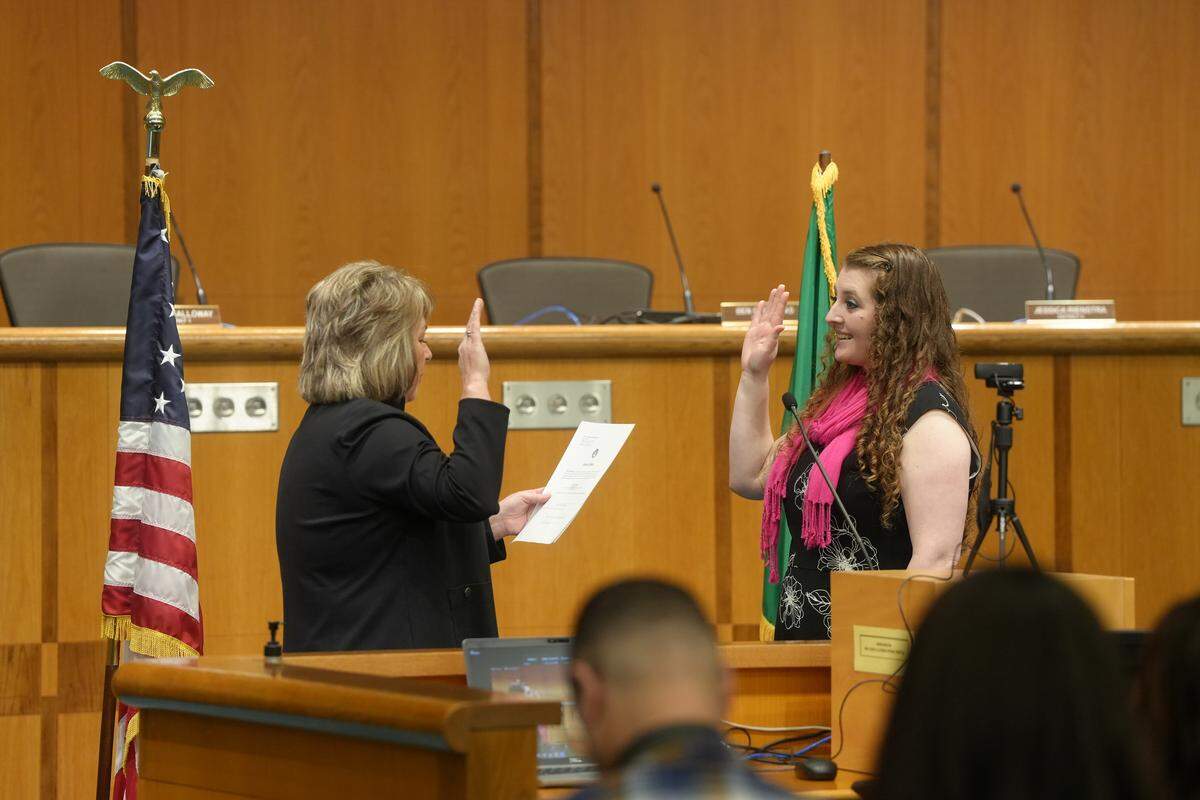 Whatcom County Council member Kaylee Galloway (right) participates in the oath of office ceremony Jan. 12.