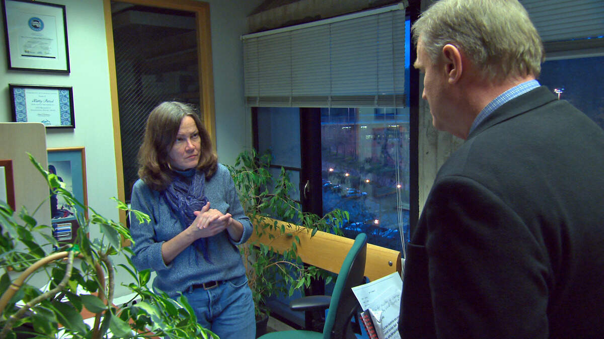 WWU’s Huxley Undergraduate Advisor and Admissions Specialist Kathryn Patrick, left, speaks with reporter Peter Van Sant in January at her office on Western’s campus. CBS’s “48 Hours” investigative series on Saturday examines a 30-year-old murder of an American teacher in South Korea and how an advisor at Western Washington University may be linked to the crime.
