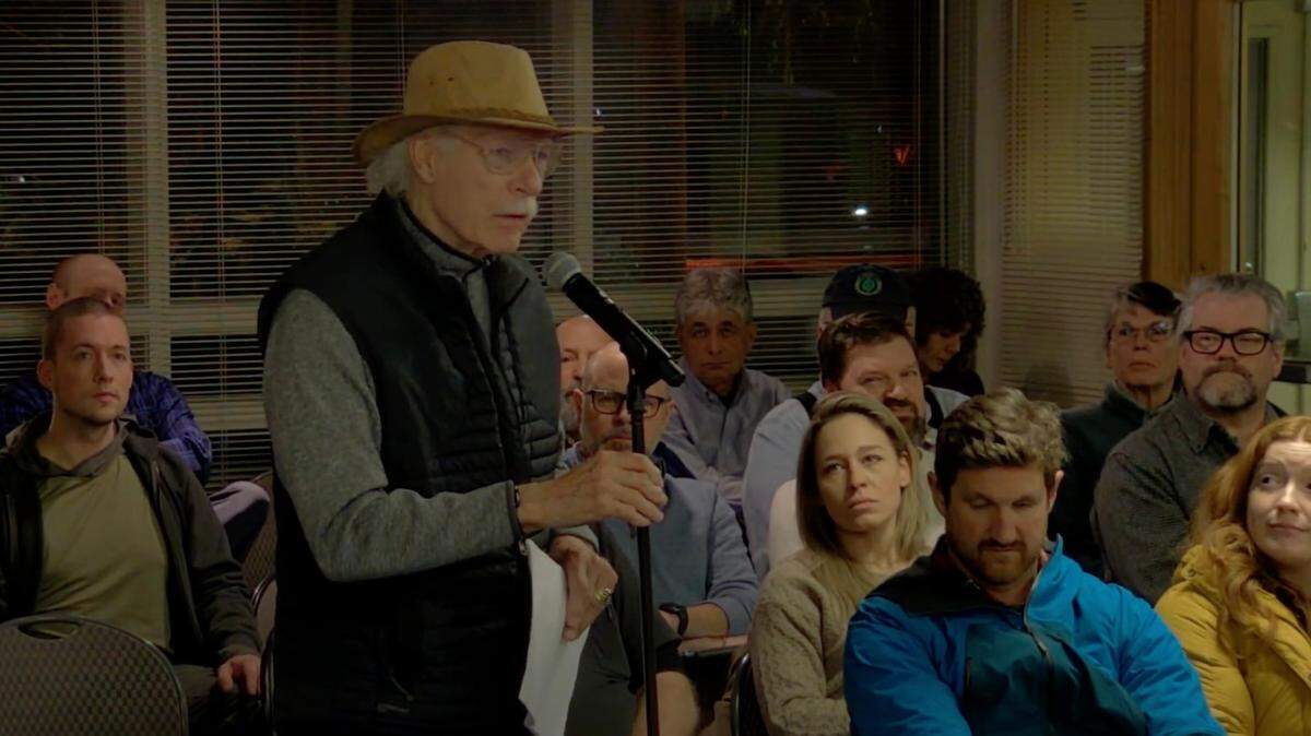 Former Bellingham Mayor and former Whatcom County Parks and Recreation Director Ken Hertz speaks during Port of Bellingham public hearing on Dec. 17 in favor of putting a measure on the next ballot that would allow residents to vote on whether to increase the number of Port commissioners from three to five.