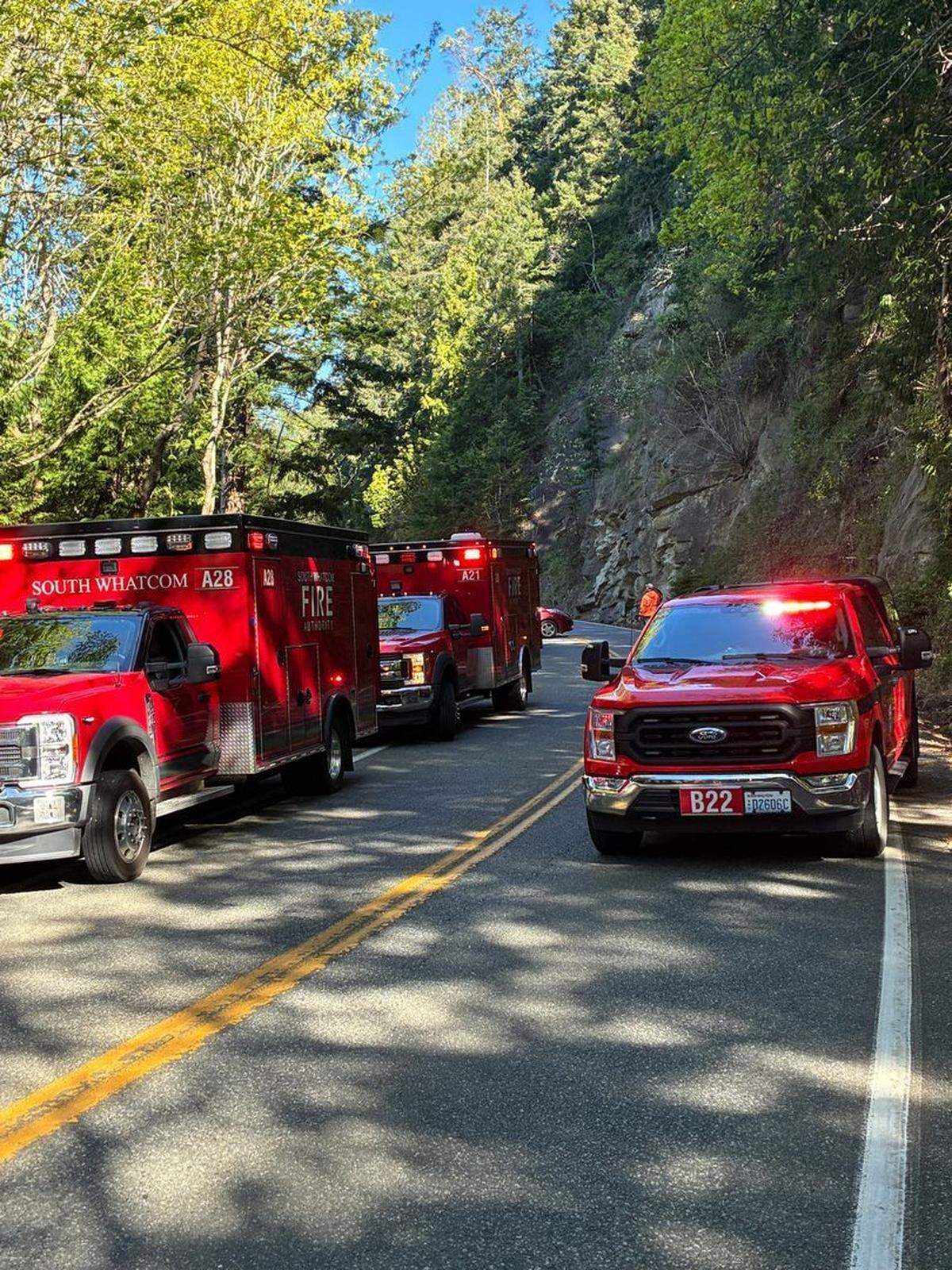Rescuers with the South Whatcom Fire Authority arrived to save a woman on April 25, 2026, who said she was trapped in her car for three days off Chuckanut Drive, south of Bellingham, Wash.