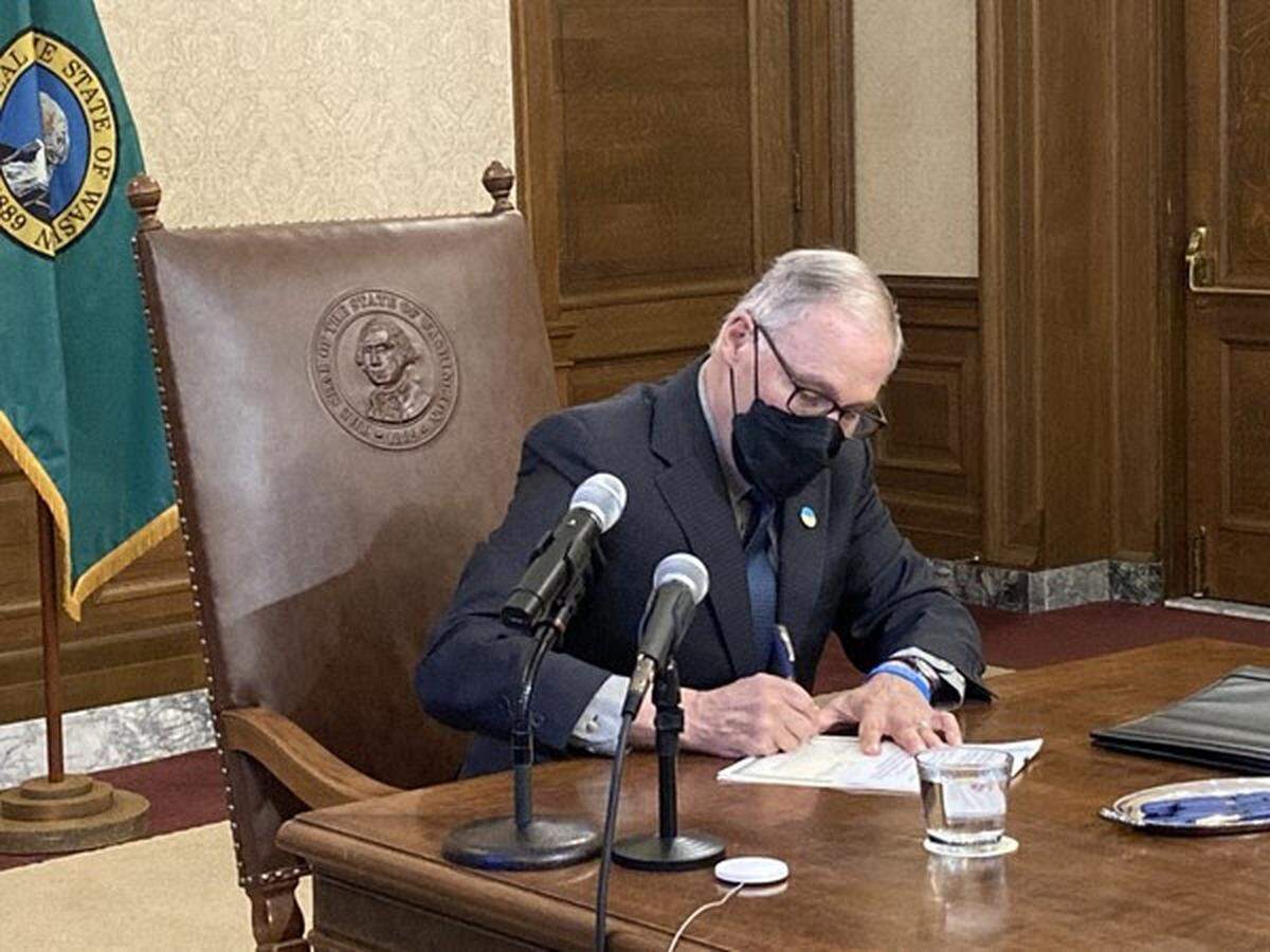 Gov. Jay Inslee signed nine bills Friday, March 3, in Olympia, including two that clarify portions of the police reform package passed by the Legislature last year.