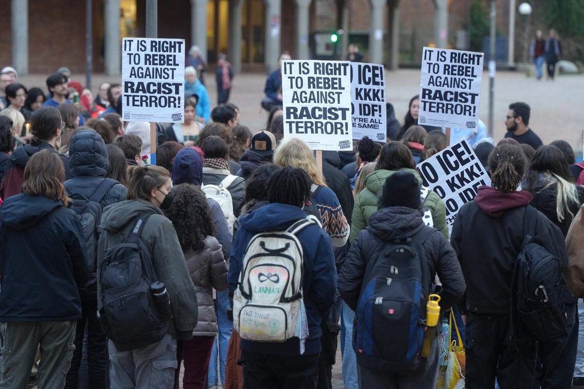 About 100 people gathered at Western Washington University for an anti-ICE vigil on January 26, 2026, in Bellingham, Wash.
