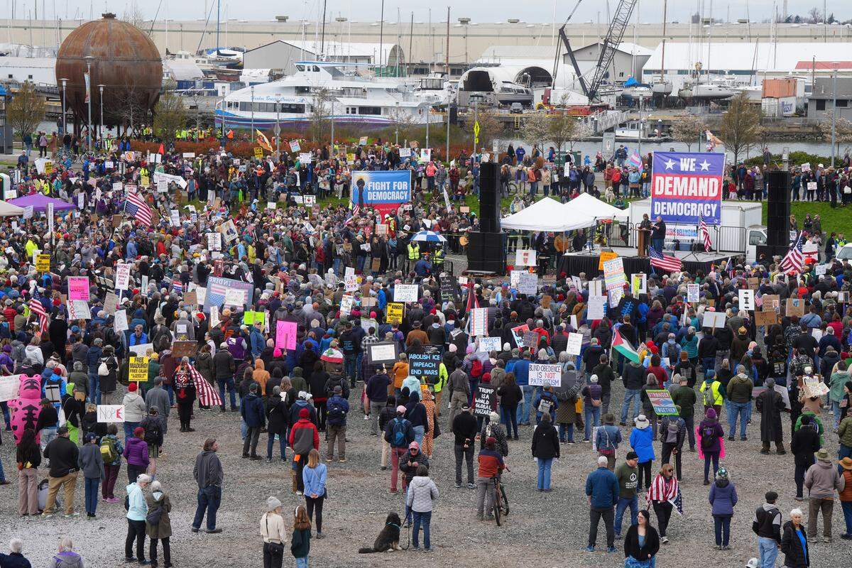 Hundreds gathered for the No Kings march and rally along the waterfront near Waypoint Park on Saturday in Bellingham.