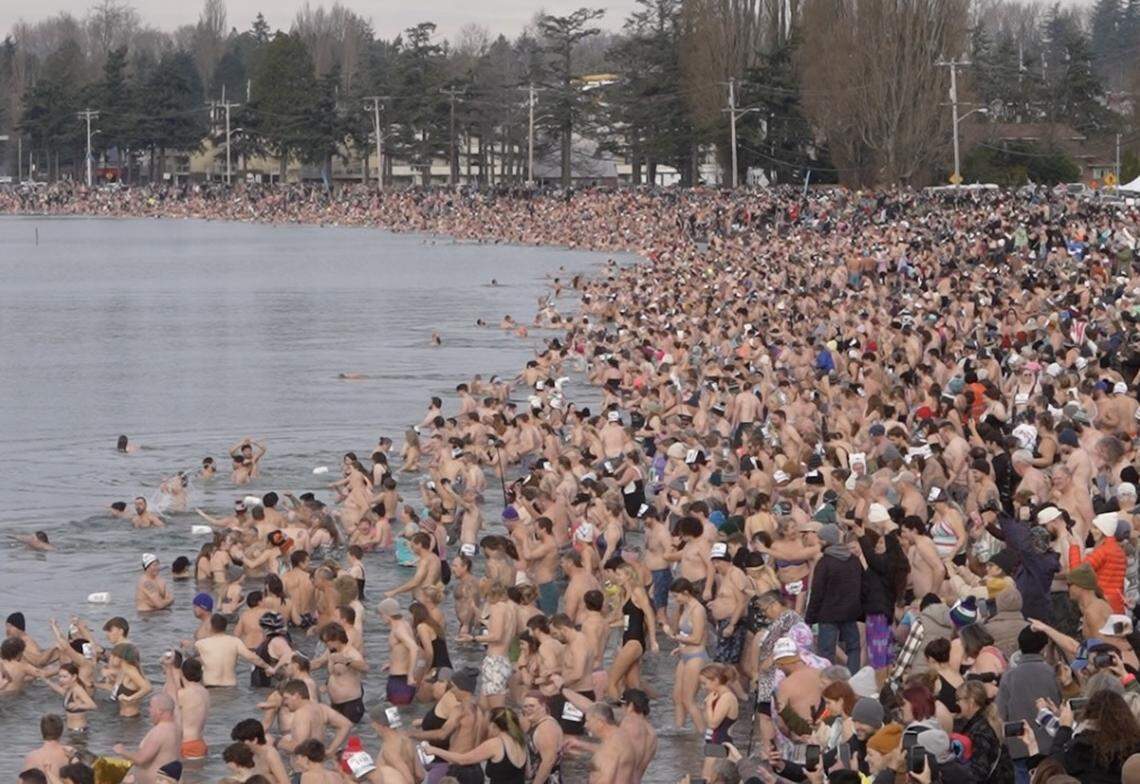 Thousands waded into the bay to attempt to break the world record for the largest polar bear dip on January 1, 2026, in Birch Bay, Wash.