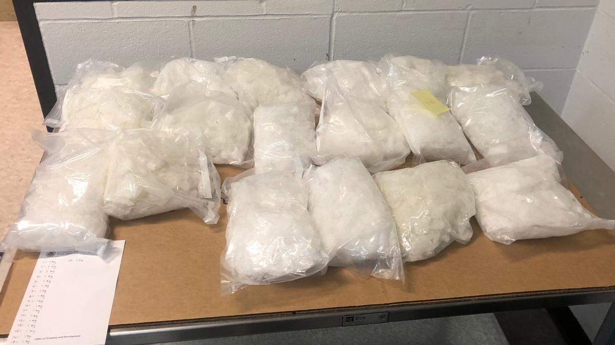 The U.S. Border Patrol recovered two backpacks containing 83 pounds of methamphetamine Thursday after an agent fought with two people who crossed the U.S.-Canada border illegally near Sumas.