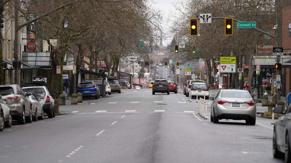 Cars drive down Holly Street in downtown Bellingham.