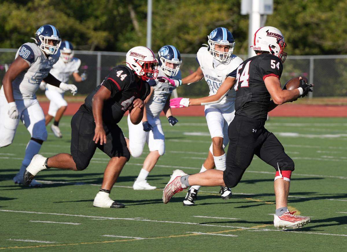 Bellingham Bayhawks player Jordan Stone runs the football in a game against the Meadowdale Mavericks on Sept. 8, 2023. Meadowdale came back in the second half to beat Bellingham 34-28.