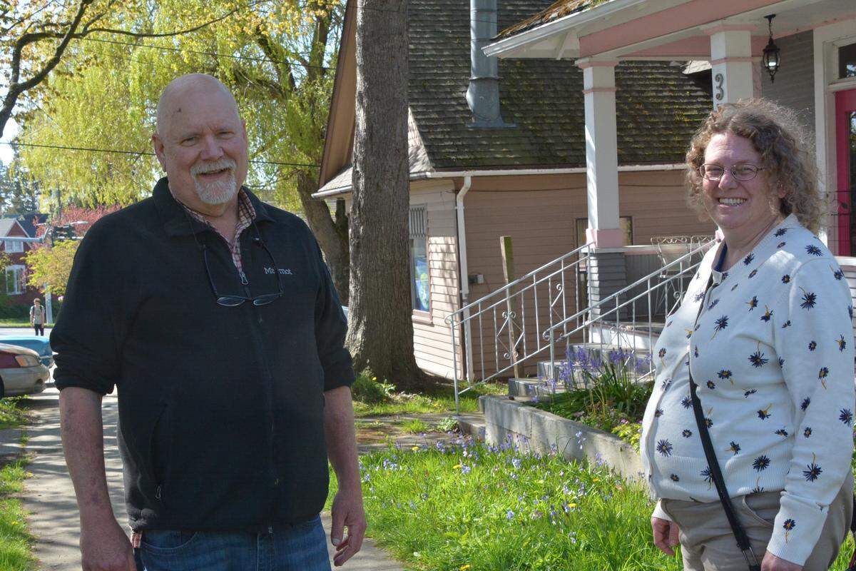 Mark Sherman, left, and Kim Bogren Owen pause during a recent tour of the York neighborhood.