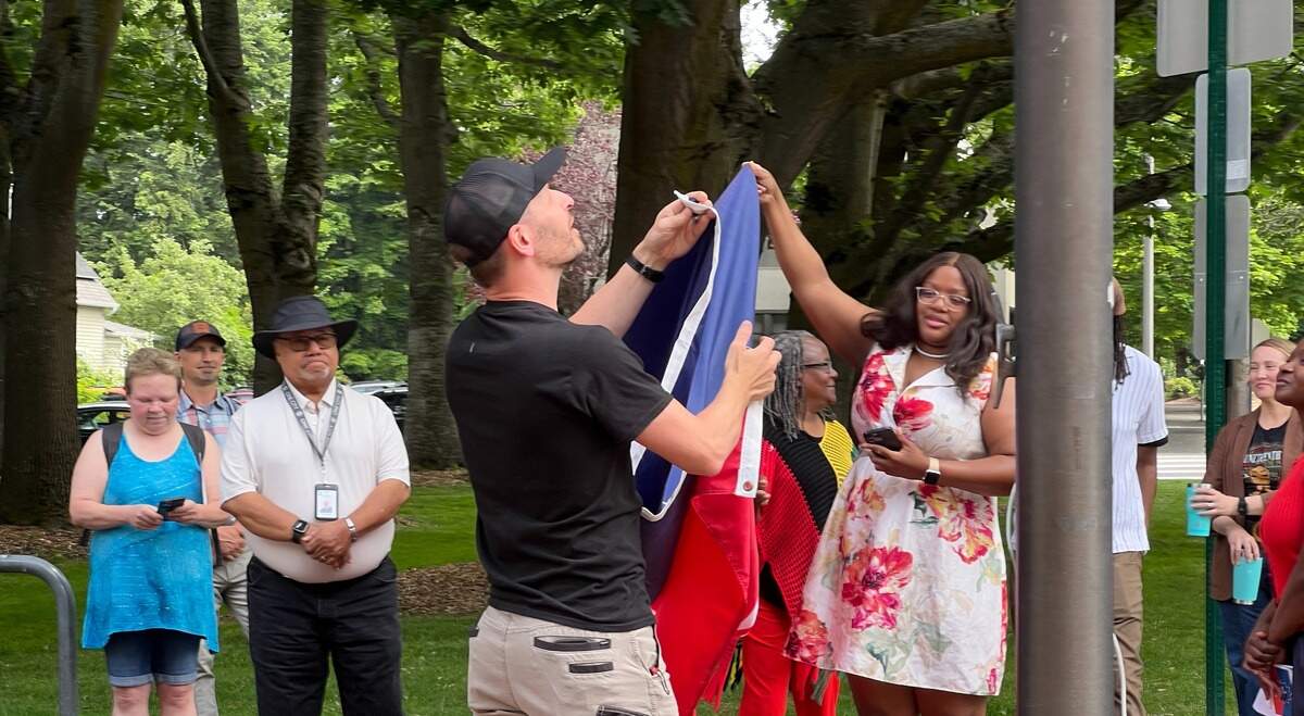 The Juneteenth flag is raised Monday, June 15 outside City Hall in Bellingham, Wash.