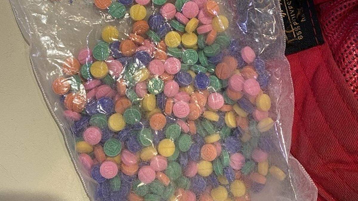 A photograph of rainbow-colored fentanyl pills seized in November 2022 as part of an investigation into a drug trafficking network operating in Whatcom and Skagit counties.