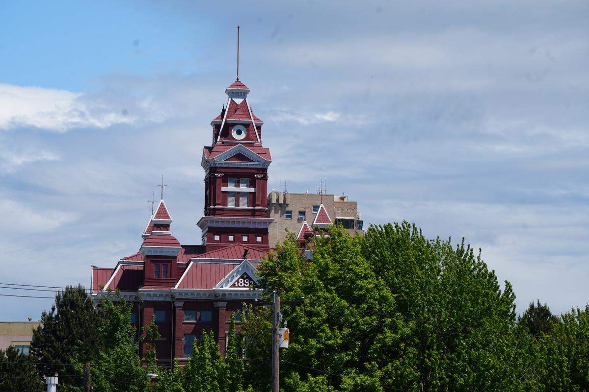 Whatcom Museum’s Old City Hall peaks through the trees in Bellingham.