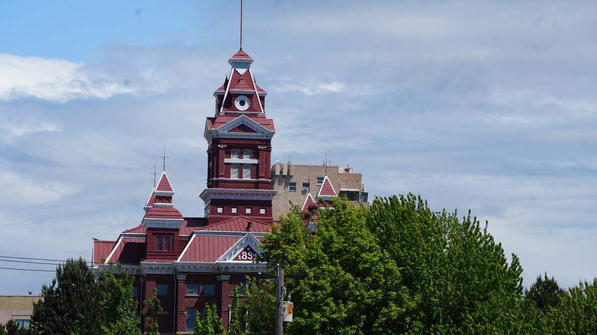 Whatcom Museum’s Old City Hall peaks through the trees on May 29, 2025, in Bellingham, Wash.
