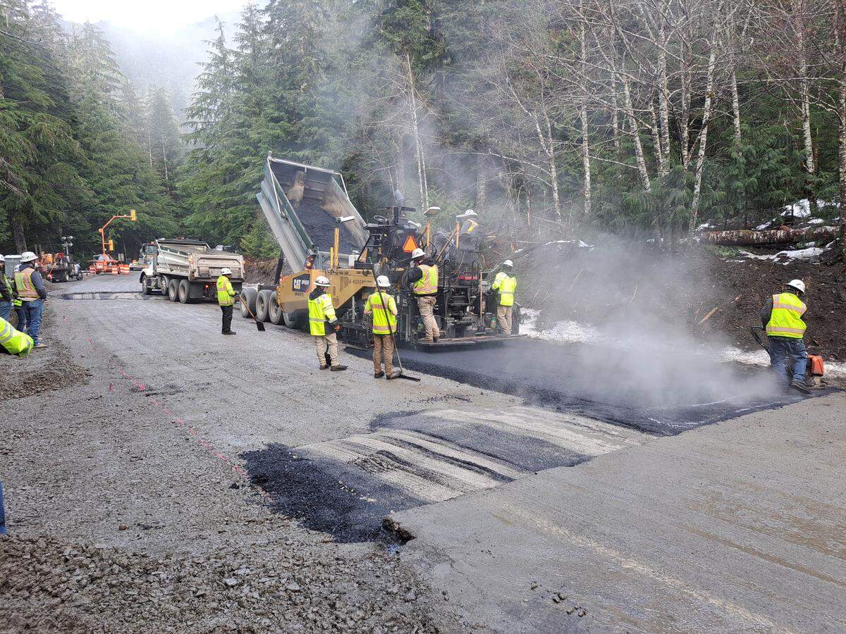 A contractor crew for the Washington State Department of Transportation paves a section of the Mount Baker Highway near milepost 43 in an undated photo taken during a closure last week to make repairs from storm damage in December.
