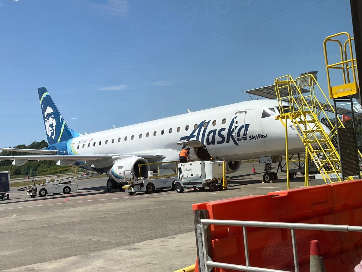 An Alaska Airlines jet waits at the Bellingham (Wash.) International Airport terminal on June 28, 2023.