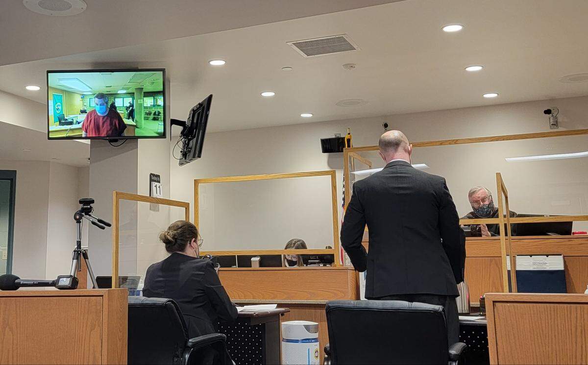 Joel Young, who is accused of two counts of first-degree attempted murder of two Whatcom County Sheriff’s deputies, makes his first appearance by video in Whatcom County Superior Court Friday, Feb. 11.