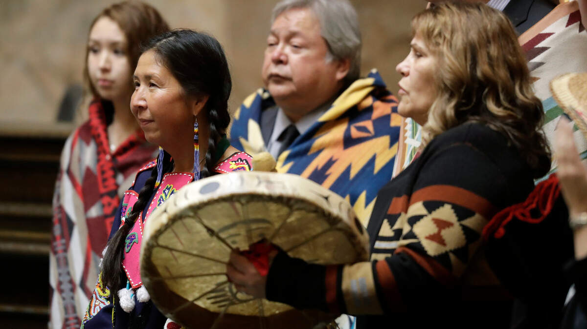 Rep. Debra Lekanoff, D-Bow, second from left, is honored with a song during a ceremony on the opening day of the Washington Legislature on Monday, Jan. 14, 2019 at the Capitol in Olympia, Wash. Lekanoff, whose 40th District includes a southern portion of Whatcom County, was sworn in Monday as the first Native American woman to serve in the Washington House.