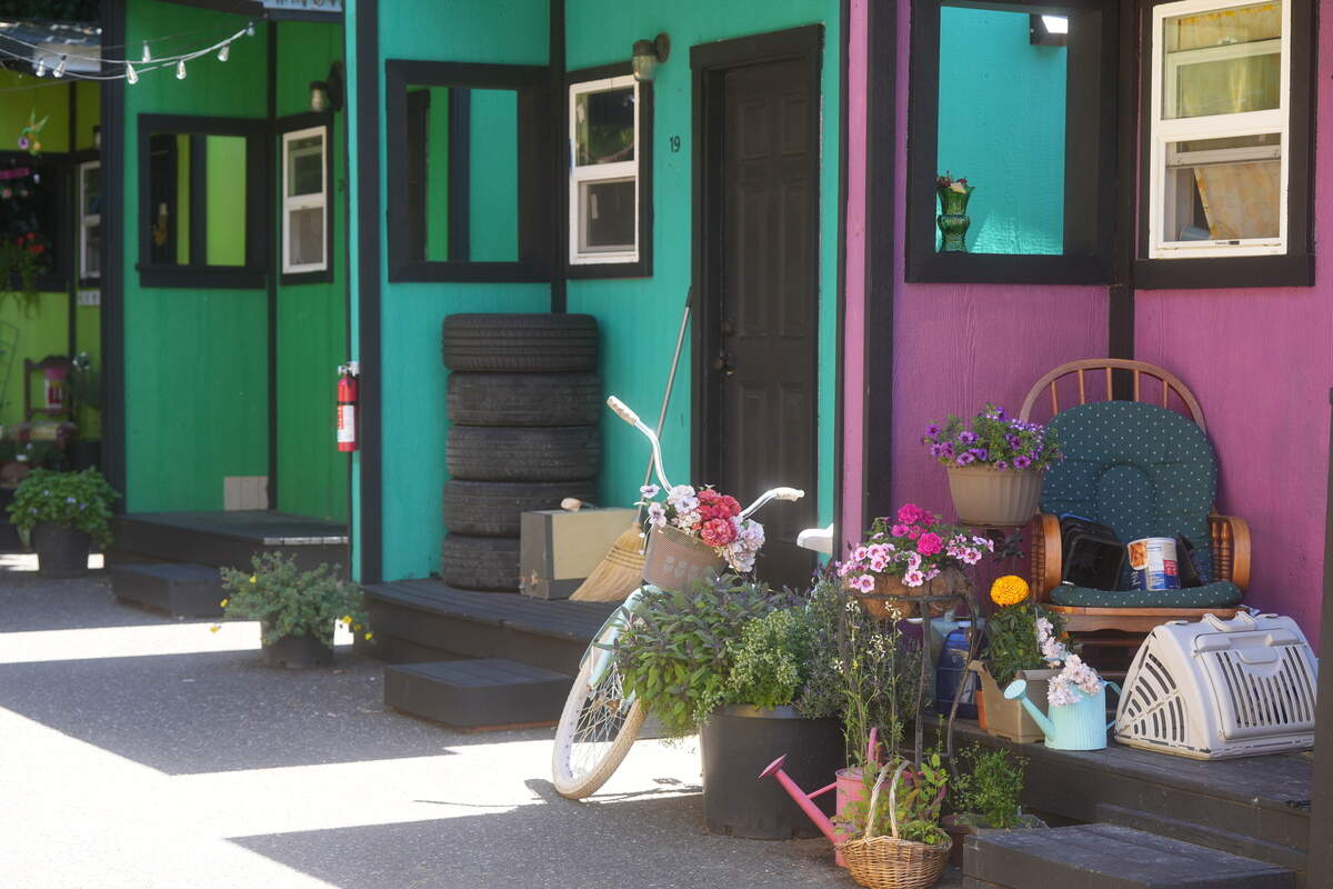 Plants and a bicycle decorate the front of one of the tiny homes at the North Haven village.