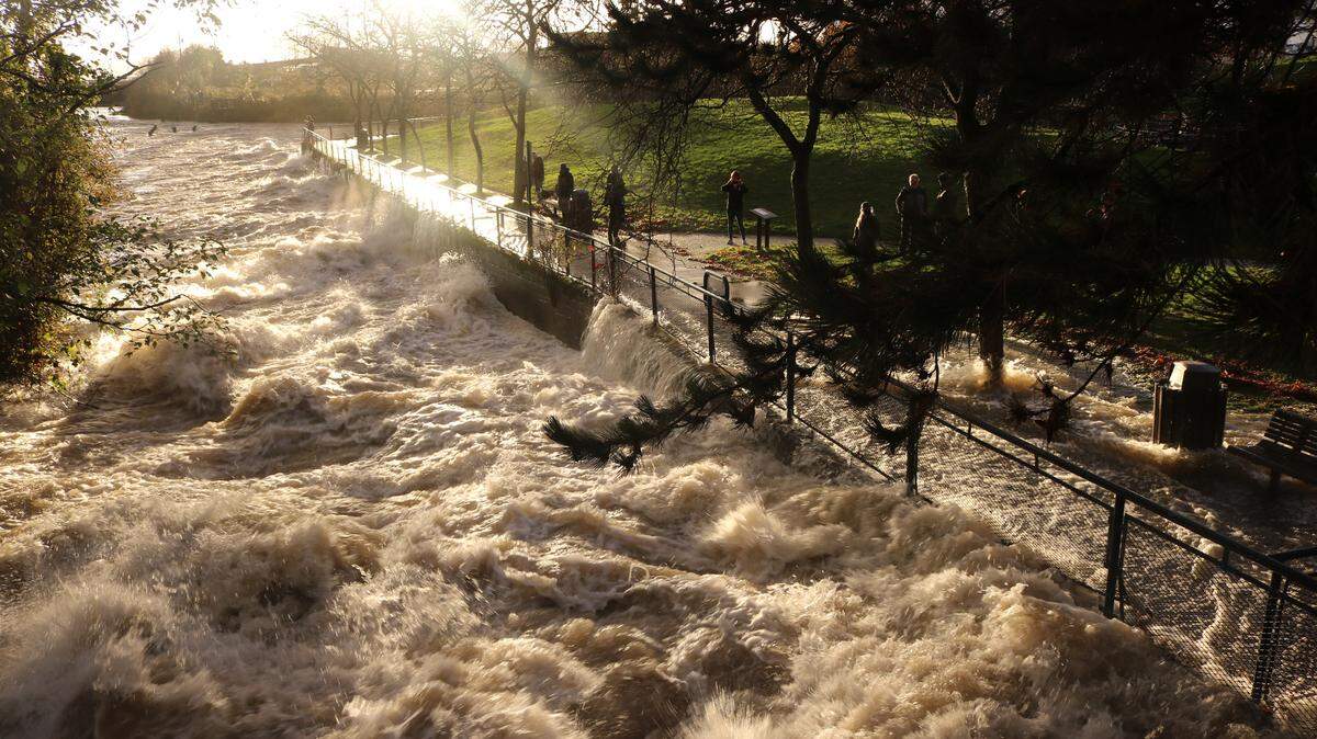 Whatcom Creek overflowed onto the sidewalks at Maritime Heritage Park in Bellingham on Monday, Nov. 14, 2021.