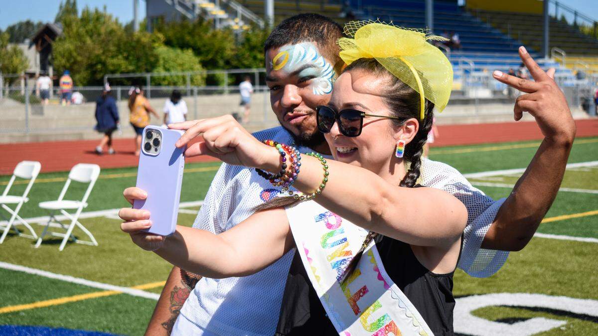 Phoenix Johnson, right, a Two Spirit member of the Tlingit and Haida Nation, takes a selfie with Elijah Campbell from the Ho-Chunk Nation of Wisconsin at The Puyallup Tribe of Indians’ third annual Pride Celebration Sunday, July 25, at Chief Leschi Schools in Tacoma. The pair were among five event attendees chosen as Puyallup Pride Royalty.