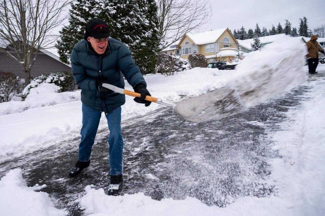 Mel White shovels snow from his driveway in the Barkley neighborhood on Thursday, Dec. 30, in Bellingham.