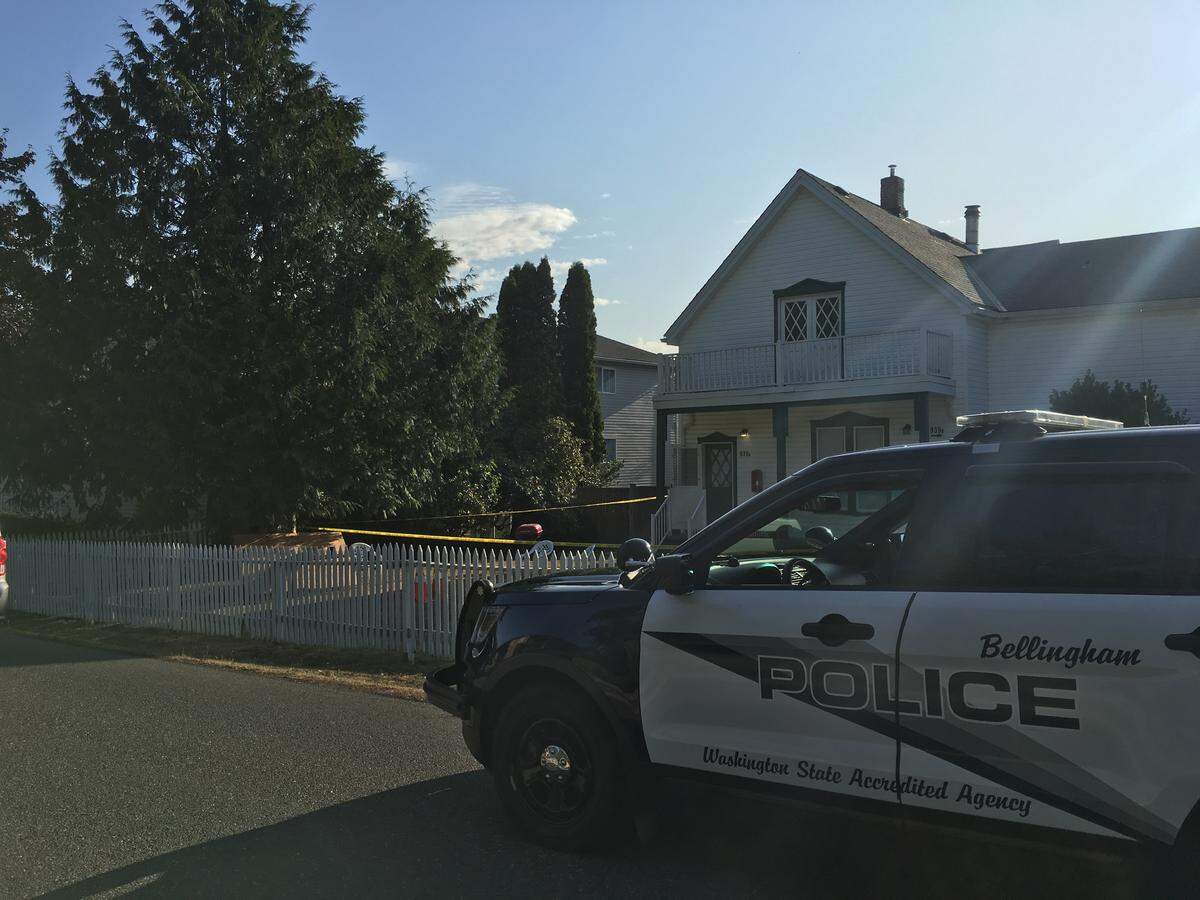 Police remain on scene Wednesday, Aug. 14, 2019, after an early morning shooting in the 900 block of 20th Street in the Happy Valley neighborhood of Bellingham, Wash.