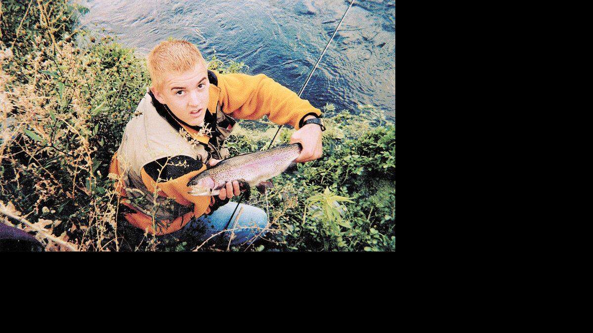 Liam Wood holds a rainbow trout during an outing at Rocky Ford Creek, a catch-and release stream near Moses Lake.